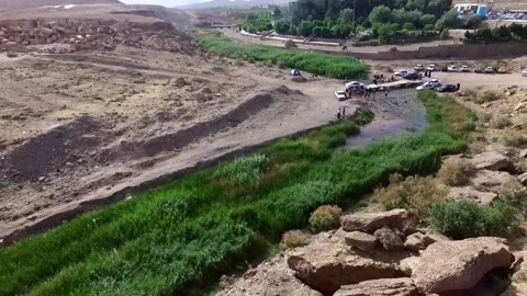 High altitude shot capturing a calm stream of water flowing, stock footage. Stock Footage 304796180