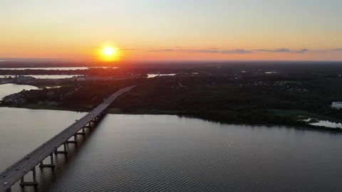 High Altitude Side Scroll Fall River Bridge at Dusk with Sunset Horizon Stock Footage 280363005