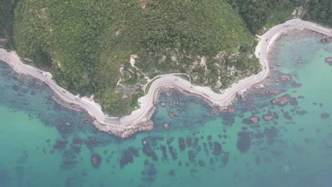 High Altitude Top Down Drone View Moving Sideways Over Korean Coastal Road Stock Footage 343195131