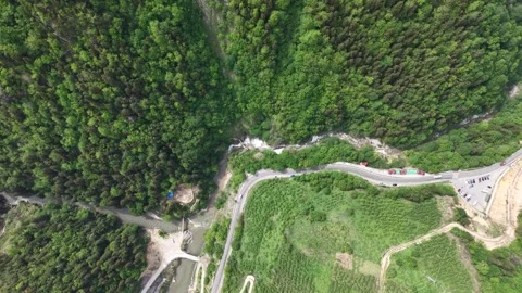High Altitude Top Down Shot Approaching Turquoise Waterfall in Forest 스톡 동영상 338226354