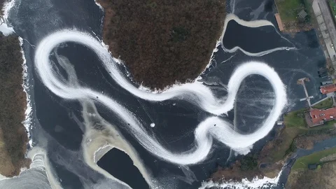 High altitude top down view of frozen lake go-kart circuit 4k Stock Footage 98836666