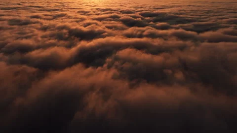 High altitude view above the clouds at sunset Stock Footage 258292513