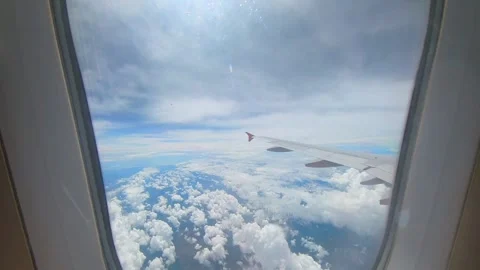 High altitude view from airplane window seat Stock Footage 293774561