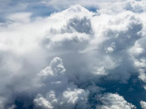 High-altitude view of clouds from airplane window Stock Photos