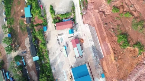 High-Altitude View of Developing Industrial Zone with Lush Greenery 動画素材 325194913