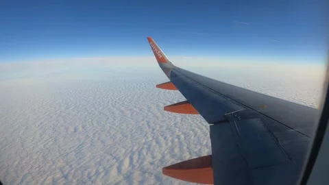 High-altitude window view of Easyjet plane Stock Footage 296332177