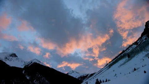 High altitude winter mountains with cloudy calm sky during sunset Stock Footage 121578467