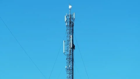 High-altitude work. Worker repair cell tower. Workman, maintenance staff at work Stock Footage 315799953