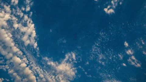 High and Mid-Level Clouds Slowly Drift Across Deep Blue Sky Time Lapse Stock Footage 283387694