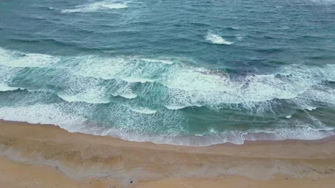 High and powerful waves coming fast to the beach, waves in winter day  Stock Footage 145034175