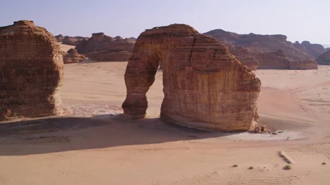 High and wide, fast flying through Elephant Rock, Al Ula, Saudi Arabia, 4K. Stock Footage 196812164