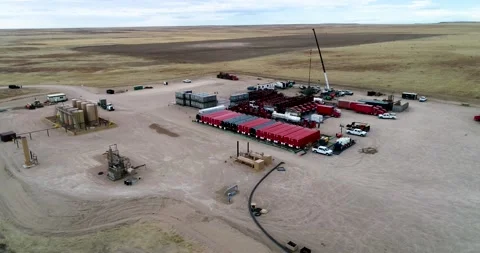 High and wide perspective of a fracking operation in Eastern Colorado Stock Footage 167396486