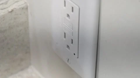 High angel view of an electrical socket in a bathroom being used. Stock Footage 313057909