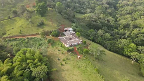 A High Angle 180 Degree Rotating Shot of a House on the Mountains Stock Footage 165175792