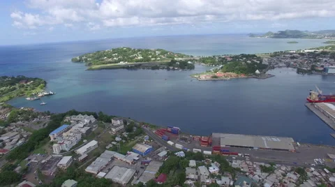 High angle above small islands and town - Caribbean Stock Footage 63454313