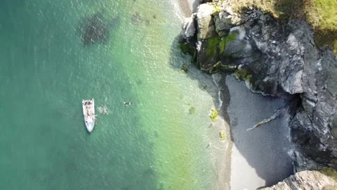 High angle aerial of a boat in clear turquoise water. Stock Footage 327623955