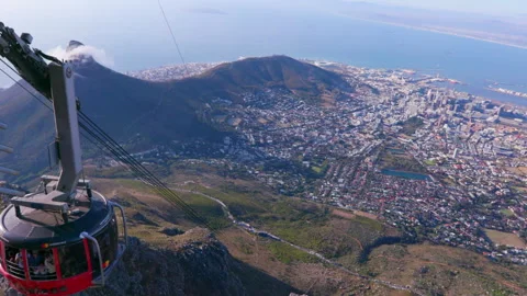 High angle: Aerial cable car travelling down the mountain HD 50p Stock Footage 242013307