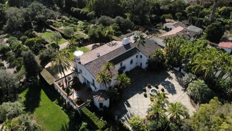 High angle aerial of Casa del Herrero historical mission museum in Montecito Stock Footage 211302026