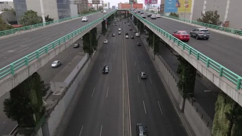 High-angle aerial drone footage showing vehicles traveling. Stock Footage 336211564