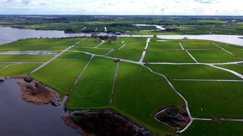 High-angle aerial drone panoramic view of expansive traditional Dutch polder Stock Footage 338131322