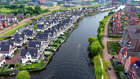 High angle aerial drone video clip of river canal with cruising boat Stock Footage 342441205