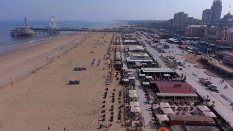 High-angle aerial drone view of Scheveningen beach resort featuring vibrant.. Stock Footage 337972089