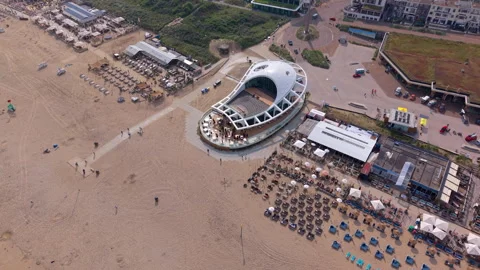 High-angle aerial drone view of Scheveningen beach resort featuring Vídeos de archivo 337972285