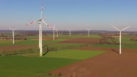 High-angle aerial drone view of a massive wind farm with industrial wind tu.. Stock Footage 338130524