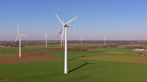 High-angle aerial drone view of modern wind turbines in a large wind farm f.. Stock Footage 338130658