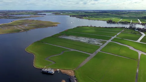 High-angle aerial drone view of traditional Dutch polder landscape Stock Footage 338131323
