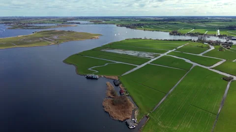 High-angle aerial drone view of a vast traditional Dutch polder landscape Stock Footage 338131390