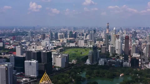 High angle aerial drone view of Bangkok skyline with urban park Stock Footage 345545234