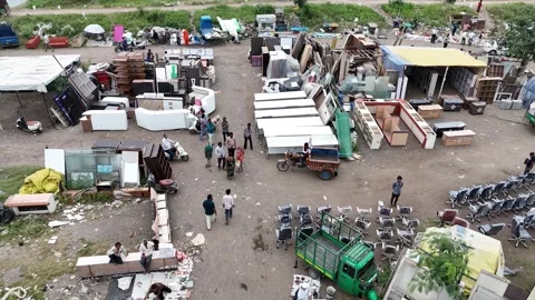 High Angle Aerial Drone View of Bustling Sunday Flea Market Stalls and Shoppers Stock Footage 346413288