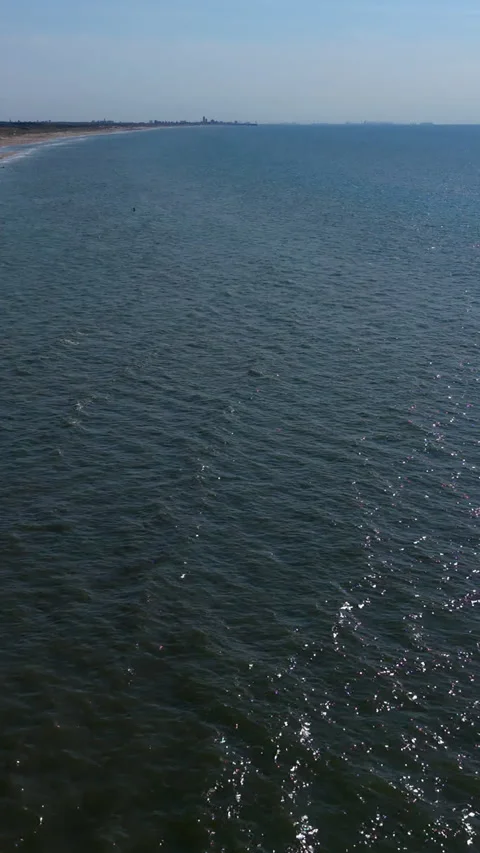 High-angle aerial drone view over glittering deep blue North Sea waters Stock Footage 347128165