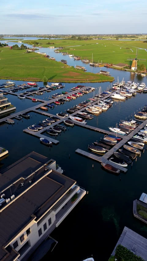 High-angle aerial drone view of busy boat marina in Warmond South Holland Stock-Footage 347129425