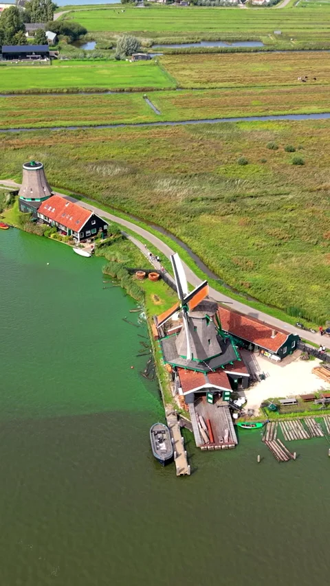High-angle aerial drone view of historic Zaanse Schans sawmill windmill Stock-Footage 347160745