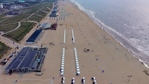 High-angle aerial drone view of Katwijk aan Zee sandy beach resort in South 動画素材 347326922