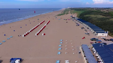 High-angle aerial drone view of Katwijk aan Zee sandy beach resort in South Vídeo Stock 347328711