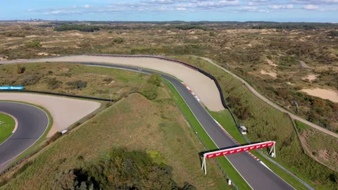 High-angle aerial drone view of Circuit Zandvoort race track straight Stock Footage 347528927