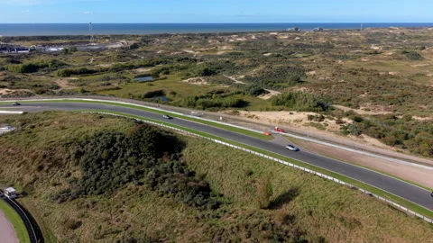 High-angle aerial drone view of Circuit Zandvoort race track straight Vídeo Stock 347549309