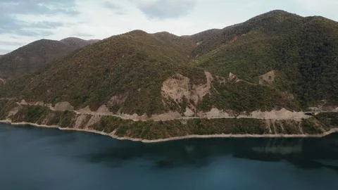 High angle aerial drone view of Zhinvali reservoir water with asphalt highw.. 스톡 사진