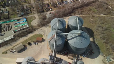 High Angle Aerial Flyover Of Massive Grain Storage Bins Stock Footage 342155645