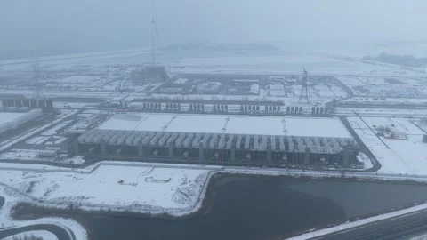 High angle aerial footage of a massive data center construction site. The vast Stock Footage 328994920
