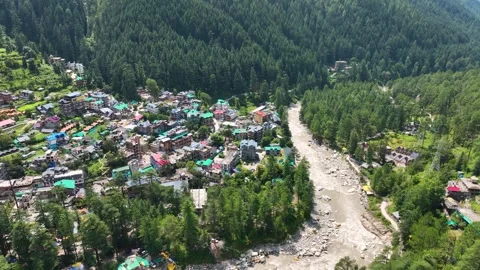 High-angle aerial Orbit shot capturing Parvati River beside Kasol town Stock-Footage 345274647