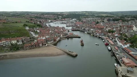 High angle aerial orbit of Whitby town, north Yorkshire, English coast Stock Footage 199680951