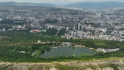 High-angle aerial panorama of Turtle Lake and Tbilisi city skyline. Stock Footage 339864136