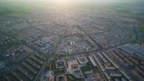 High-Angle Aerial Panoramic View of Tekes Bagua City at Golden Sunset Stock Footage 343583292