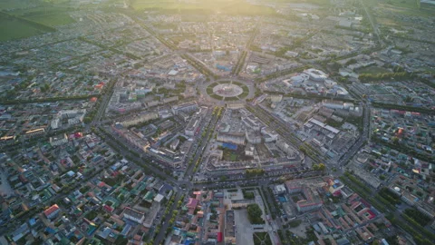High-Angle Aerial Panoramic View of Tekes Bagua City at Golden Sunset Stockbeeldmateriaal 343583602