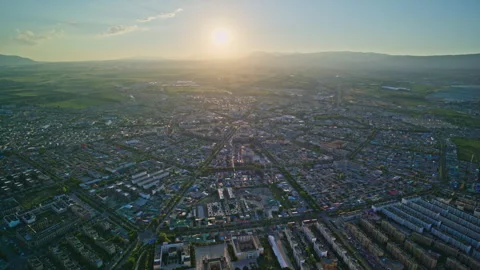 High-Angle Aerial Panoramic View of Tekes Bagua City at Golden Sunset Stock Footage 343584724