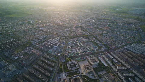 High-Angle Aerial Panoramic View of Tekes Bagua City at Golden Sunset Stock Footage 343585234